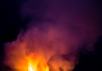 Fototapeta na wymiar fire with smoke on a black background