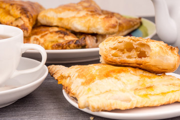 Delicious golden sweet triangles of puff pastry close-up