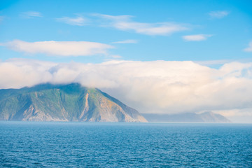 Landscape of the Mountain and sea with cloudy in the morning. View from the ferry to  South Island, New Zealand.