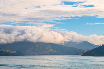 Landscape of the Mountain and sea with cloudy in the morning. View from the ferry to  South Island, New Zealand.