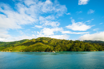 Landscape of the Mountain and sea with cloudy in the morning. View from the ferry to  South Island, New Zealand.