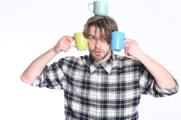 handsome guy holding cups isolated on white background