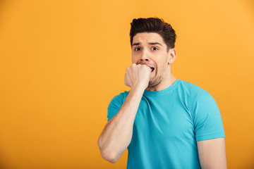 Portrait of a scared young man in t-shirt