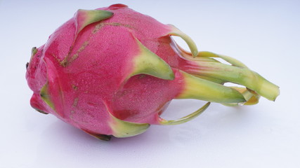 Closeup of dragon fruit on white background.Selective focus and crop fragment.