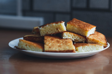 beautiful casserole on a plate of Golden-colored cottage cheese sweet tasty