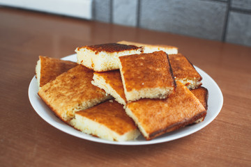 beautiful casserole on a plate of Golden-colored cottage cheese sweet tasty