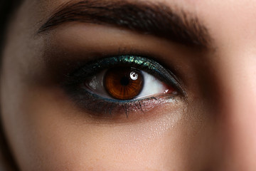 Obraz premium Female left green coloured eye extreme closeup