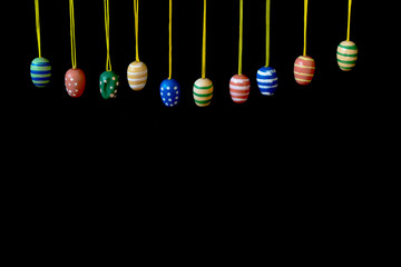 Easter eggs on black background. Copy space.