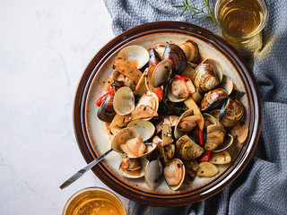 Stir-frying Ginger and clams at high heat to bring forth the savory aroma   with sesame oil in...