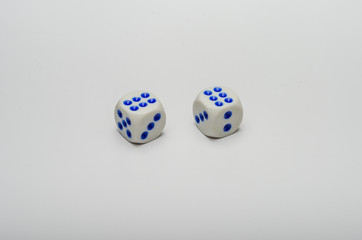 Game dice on which a combination of two sixes fell on a white background
