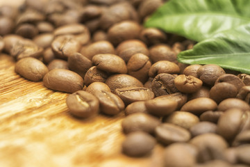 Coffee Beans over Wood Background