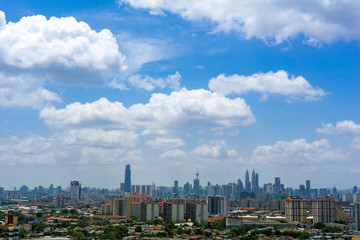 A clear and windy day in Kuala Lumpur, capital of Malaysia. Its modern skyline is dominated by the 451m tall KLCC, a pair of glass and steel clad skyscrapers.