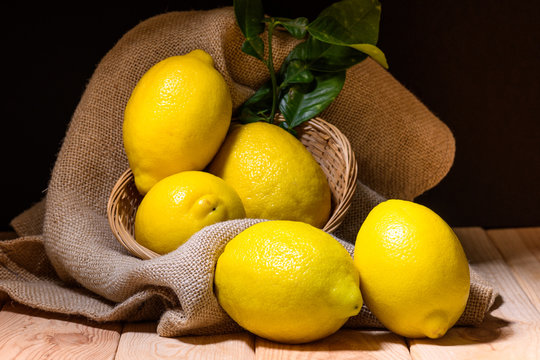 still life of fresh limines on dark wood