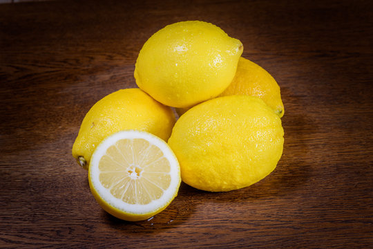 still life of fresh limines on dark wood