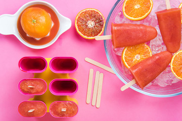 Fototapeta na wymiar Ingredients for blood orange popsicles