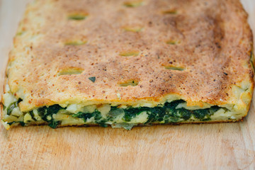 Cake with spinach egg and cheese. Tasty pie