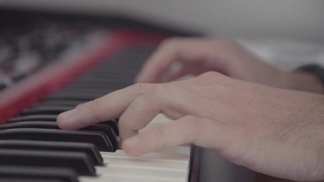 Close up shot of a piano (keyboard) being played