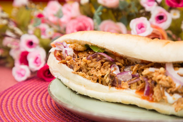 Tasty colorful sandwich with french bun.