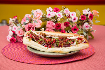 Tasty colorful sandwich with french bun.