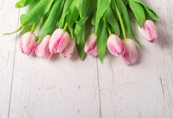 Bouquet of tulips on wooden background
