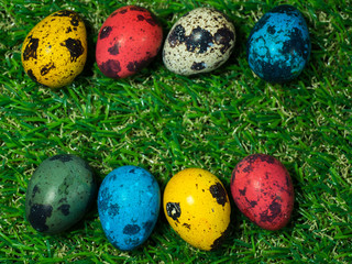 colorful of easter eggs placed on green grass. Easter day concept. copy space for text