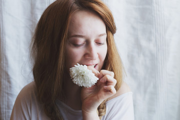 Beautiful ginger woman with white chrysanthemum