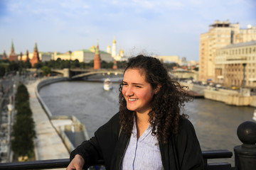 Portrait of beautiful girl on the Moscow city background