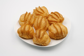 Cake eclair on a white plate