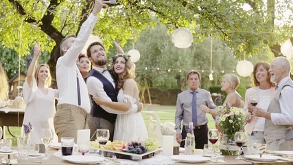 Wedding reception outside in the backyard. - Powered by Adobe