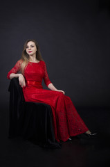 Fototapeta na wymiar Portrait of a beautiful girl in a red dress.