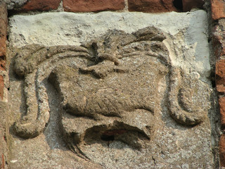Historical destroyed stone decorative element of the building