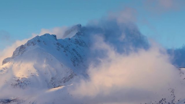 Winter timelapse between sunset and twilight of Bure Peak (Pic de Bure) in the Devoluy Massif. Hautes-Alpes, French Alps, France