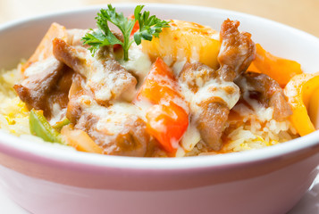 bowl of grilled beef with cheese and pimiento