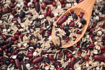 Cereal grains , seeds, beans on wooden background.