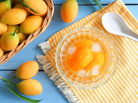 Marian plum or plango fruit in syrup serve with ice, Thai dessert in summer season.