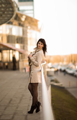 Confident business woman on a modern office building background