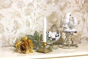 Beautiful composition. Flowers, a vase and a candle. Rose 