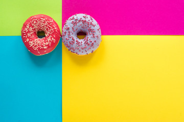 donuts on a beautiful colored background, pastel glamor colors