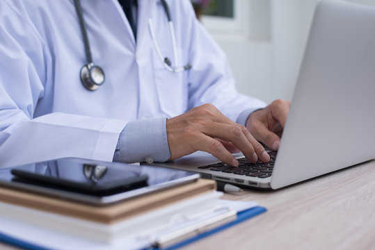 Doctor working on laptop computer