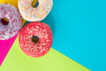 donuts on a beautiful colored background, pastel glamor colors