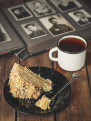 cake - Napoleon (puff cake with white cream) on a wooden table