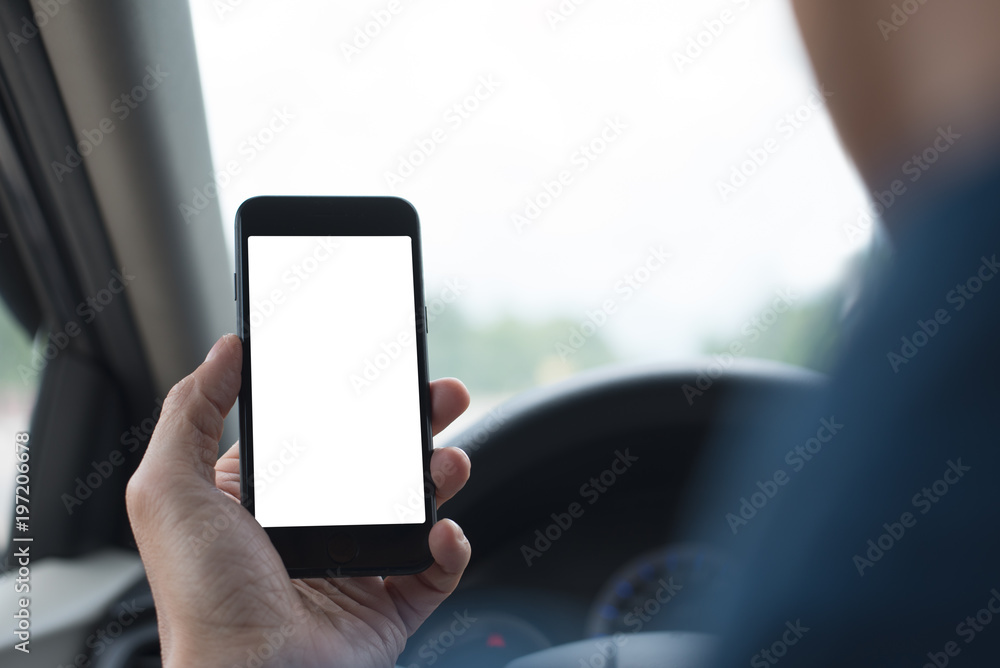 Poster man using smartphone inside a car