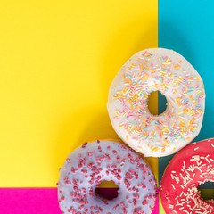 donuts on a beautiful colored background, pastel glamor colors