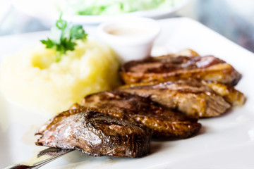 juicy steak veal beef meat with tomato and potatoes