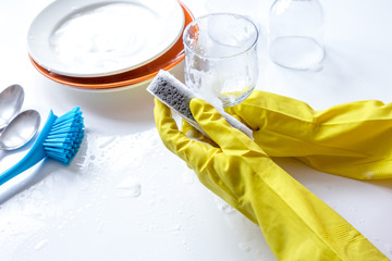 concept of woman washing dishes on white background
