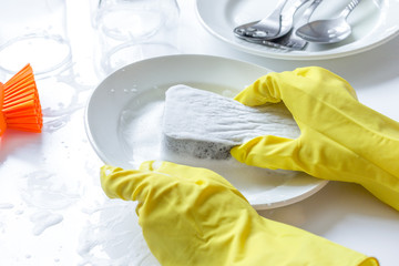 concept of woman washing dishes on white background