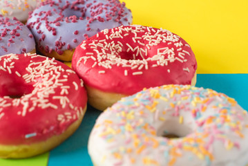donuts on a beautiful colored background, pastel glamor colors