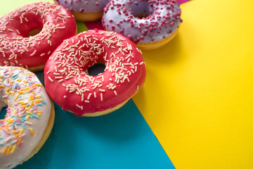 donuts on a beautiful colored background, pastel glamor colors