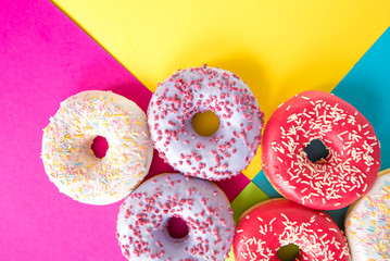 donuts on a beautiful colored background, pastel glamor colors