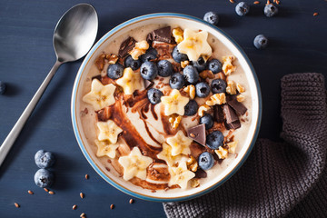 healthy banana smoothie bowl with blueberry chocolate walnuts